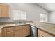 Kitchen features granite countertops, stainless steel appliances, and lots of natural light at 3414 Drescina Way, North Las Vegas, NV 89031