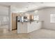 Kitchen boasts stainless steel appliances, granite counters, and lots of natural light at 3414 Drescina Way, North Las Vegas, NV 89031