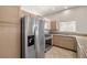 Kitchen boasts stainless steel appliances, granite counters, and beautiful wood cabinets at 3414 Drescina Way, North Las Vegas, NV 89031