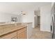 Kitchen boasts granite counters and stainless steel appliances and is open to the living room at 3414 Drescina Way, North Las Vegas, NV 89031