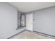 Garage area featuring a modern water heater and access door, ensuring functionality at 3414 Drescina Way, North Las Vegas, NV 89031