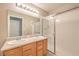Bathroom with a double sink vanity and a shower with glass doors at 370 Manti Pl # 21, Henderson, NV 89014