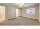 Bedroom with a ceiling fan and window overlooking the neighborhood at 370 Manti Pl # 21, Henderson, NV 89014