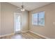 Bright bedroom featuring wood floors, a ceiling fan, and a sliding door to the outside at 370 Manti Pl # 21, Henderson, NV 89014