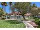 Beautifully landscaped apartment complex with mature trees and well-manicured lawns at 370 Manti Pl # 21, Henderson, NV 89014