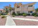 The exterior view shows the building facade, landscaping, and sidewalk at 370 Manti Pl # 21, Henderson, NV 89014