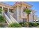Shot of the building exterior showing stairways, balconies, and desert landscaping at 370 Manti Pl # 21, Henderson, NV 89014