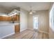 Open floor plan with a well-equipped kitchen with stainless steel appliances and natural wood cabinets at 370 Manti Pl # 21, Henderson, NV 89014