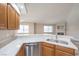 Modern kitchen boasts a stainless steel dishwasher, double sinks and quartz countertops at 370 Manti Pl # 21, Henderson, NV 89014