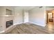 Open living room with wood-look flooring and a fireplace feature at 370 Manti Pl # 21, Henderson, NV 89014