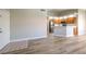 Open concept living room with wood floors and an adjoining kitchen at 370 Manti Pl # 21, Henderson, NV 89014