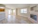 Spacious living room featuring wood floors, fireplace and a ceiling fan at 370 Manti Pl # 21, Henderson, NV 89014