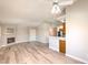 Open concept living room with a fireplace and hardwood floors at 370 Manti Pl # 21, Henderson, NV 89014