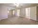 Spacious main bedroom with a ceiling fan, carpet flooring, and closet with mirrored sliding doors at 370 Manti Pl # 21, Henderson, NV 89014