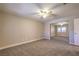 This main bedroom features carpet flooring and a closet with mirrored sliding doors at 370 Manti Pl # 21, Henderson, NV 89014