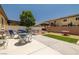 Spacious backyard features a concrete patio, green grass, seating areas, and privacy fence at 3773 Blake Canyon Dr, North Las Vegas, NV 89032