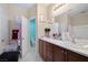 Bathroom featuring double vanity sinks, framed mirror and toilet in separate room at 3773 Blake Canyon Dr, North Las Vegas, NV 89032