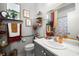 Bathroom featuring a stylish vanity with a sink, a framed mirror and a toilet at 3773 Blake Canyon Dr, North Las Vegas, NV 89032