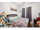 Bright bedroom with queen-size bed, colorful accents, and window with natural light at 3773 Blake Canyon Dr, North Las Vegas, NV 89032