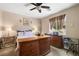 Bright bedroom featuring a dresser, window, ceiling fan and natural light at 3773 Blake Canyon Dr, North Las Vegas, NV 89032
