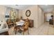 Elegant dining area featuring a round table, decorative mirror, and stylish chairs, perfect for gatherings at 3773 Blake Canyon Dr, North Las Vegas, NV 89032