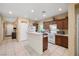 Functional kitchen with ample cabinet space, a breakfast bar, and essential appliances for easy meal preparation at 3773 Blake Canyon Dr, North Las Vegas, NV 89032