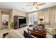 Cozy living room with neutral tones, comfortable seating, and a large television for entertainment at 3773 Blake Canyon Dr, North Las Vegas, NV 89032
