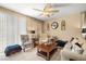 Relaxing living room featuring natural light, comfortable seating, and stylish decor for a serene atmosphere at 3773 Blake Canyon Dr, North Las Vegas, NV 89032