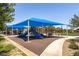 The community playground features colorful shade structures, slides, and play equipment for hours of fun at 3773 Blake Canyon Dr, North Las Vegas, NV 89032