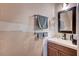 Functional bathroom featuring a modern vanity, sink, and mirror, ready for upgrades at 4036 Nightingale Ct, Las Vegas, NV 89107