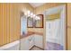 Retro bathroom with vintage wallpaper and a double mirror at 4036 Nightingale Ct, Las Vegas, NV 89107