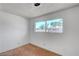 A bright, empty bedroom with a large window for ample sunlight at 4036 Nightingale Ct, Las Vegas, NV 89107