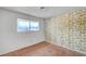 Bedroom with wallpaper and natural light from the window at 4036 Nightingale Ct, Las Vegas, NV 89107