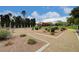 A well-maintained community garden featuring desert landscaping, mature trees, and clear blue skies at 4036 Nightingale Ct, Las Vegas, NV 89107