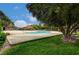The sparkling community pool features a relaxing atmosphere with mature trees and comfortable seating at 4036 Nightingale Ct, Las Vegas, NV 89107