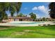 Relax at the large community pool with lounge chairs and a grassy area perfect for enjoying sunny days at 4036 Nightingale Ct, Las Vegas, NV 89107