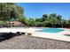 A pristine community pool area with clear blue water and comfortable seating for residents to enjoy at 4036 Nightingale Ct, Las Vegas, NV 89107