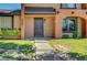 Inviting home entrance with neatly landscaped yard and a pathway leading to the front door at 4036 Nightingale Ct, Las Vegas, NV 89107