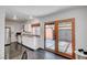 Bright kitchen with stainless steel appliances, ample counter space, and a sliding door to the backyard at 4036 Nightingale Ct, Las Vegas, NV 89107