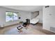 Bright living space with a plush chair, bed, and ample natural light from a large window at 4036 Nightingale Ct, Las Vegas, NV 89107