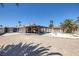 Backyard with a swimming pool, patio, and mature palm trees at 4458 El Quinta Ct, Las Vegas, NV 89121