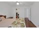 Bright bedroom featuring wood laminate flooring and ample closet space at 4458 El Quinta Ct, Las Vegas, NV 89121