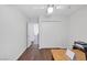 Bright bedroom with hardwood floors, a ceiling fan, and a double closet at 4458 El Quinta Ct, Las Vegas, NV 89121