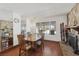 Dining room featuring a dining table set, fireplace, and view to outdoor space at 4458 El Quinta Ct, Las Vegas, NV 89121
