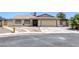 Single-story home featuring desert landscaping, a two-car garage, and neutral exterior color scheme at 4458 El Quinta Ct, Las Vegas, NV 89121