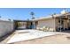 Rear exterior showcasing the patio, backyard, and a covered parking area at 4458 El Quinta Ct, Las Vegas, NV 89121