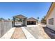 Open detached garage and metal awning with desert landscaping and a block wall at 4458 El Quinta Ct, Las Vegas, NV 89121