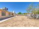 This home has a large backyard with block-wall fencing and some mature trees at 4784 El Escorial Dr, Las Vegas, NV 89121