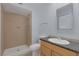 Bathroom with tile shower and wood vanity at 4784 El Escorial Dr, Las Vegas, NV 89121