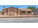 Inviting single-story residence enhanced by desert landscaping and clean, classic architecture at 4784 El Escorial Dr, Las Vegas, NV 89121